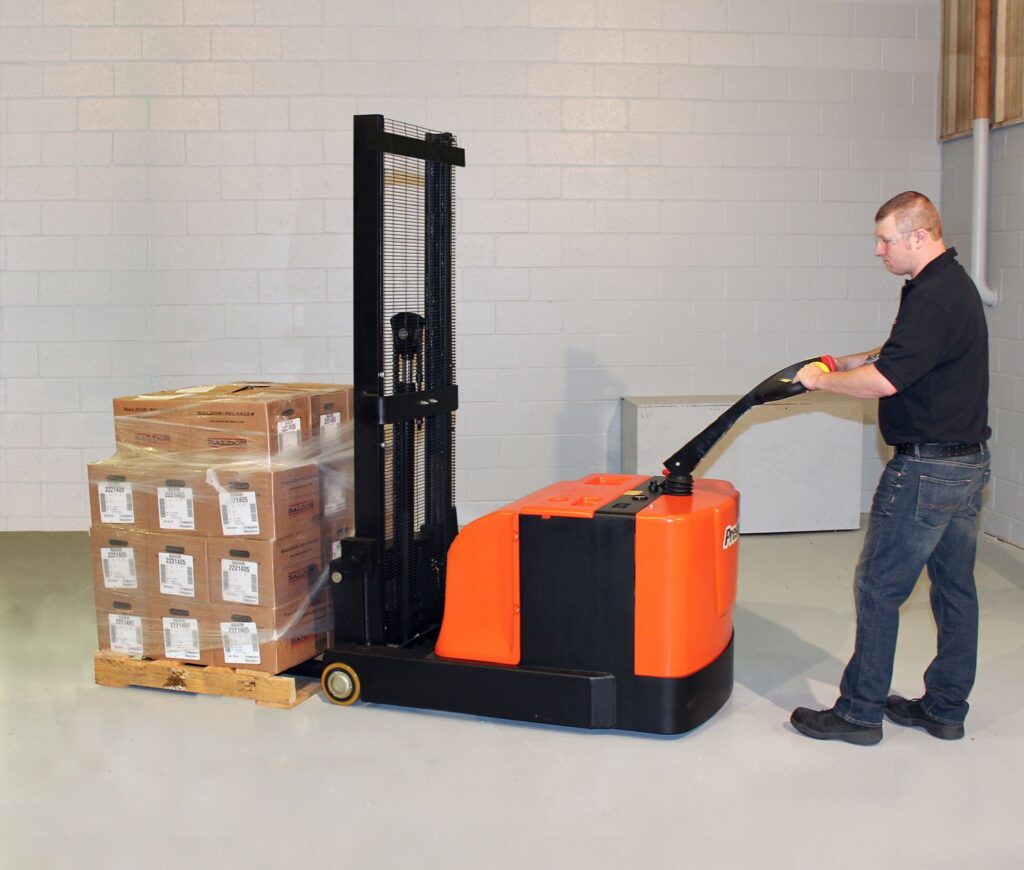 person using presto stacker in warehouse to move pallet