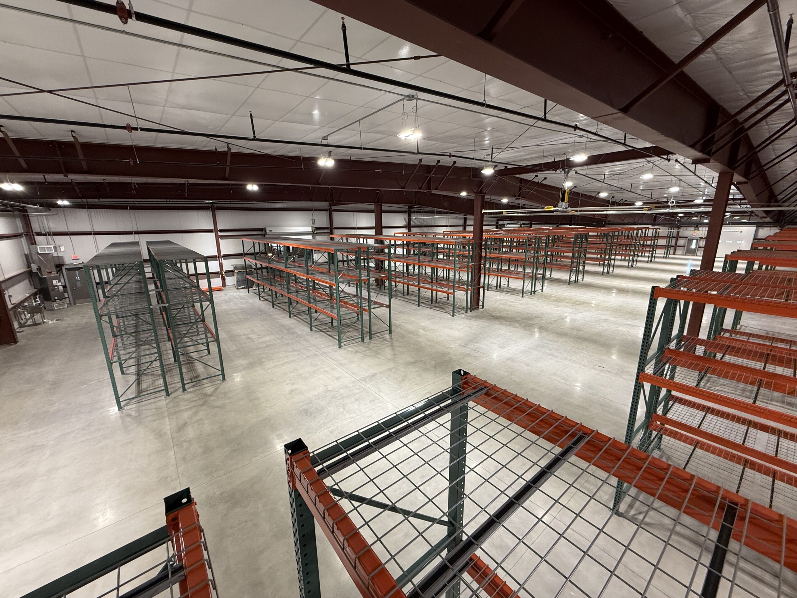 Empty warehouse with metal shelving units